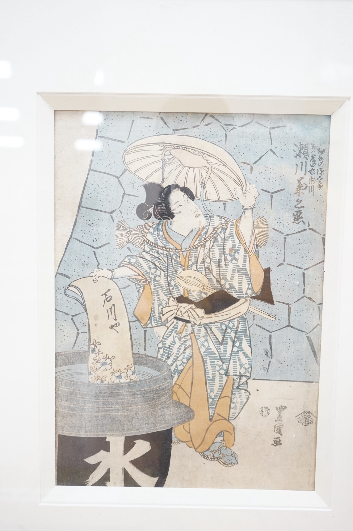 Four Japanese woodblock prints, to include: after Toyokuni - kabuki actors together with a Chinese printed booklet, largest 35 x 23cm. Condition - good